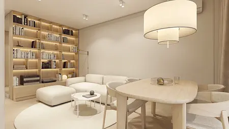 Wnętrze salonu w stylu japandi z jasnymi meblami i drewnianymi akcentami.