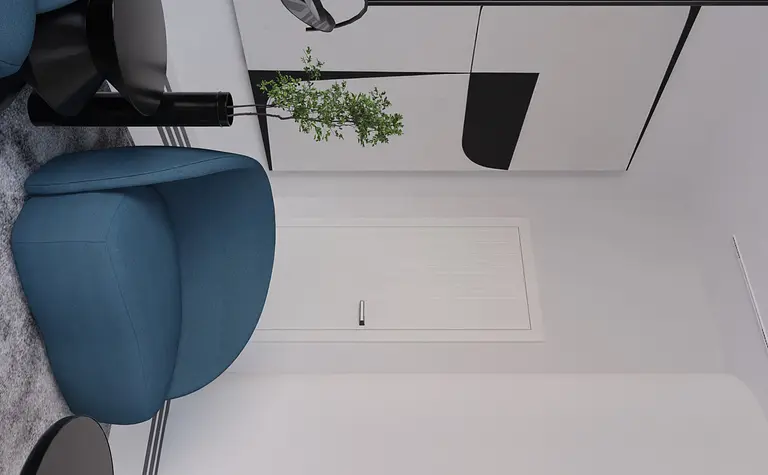 Nowoczesne wnętrze z fotelami w kolorze niebieskim, czarnym stolikiem i minimalistycznymi akcentami.
