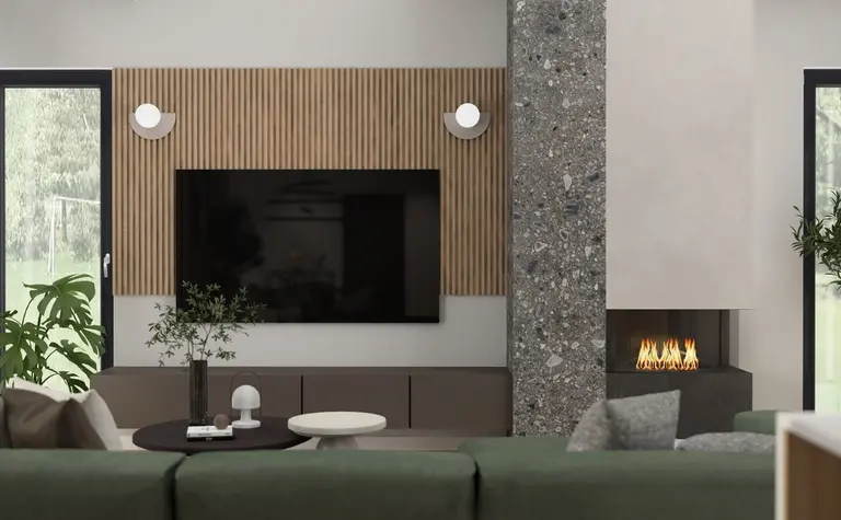 Wnętrze salonu z zieloną kanapą, drewnianymi detalami i industrialnym kominkiem.