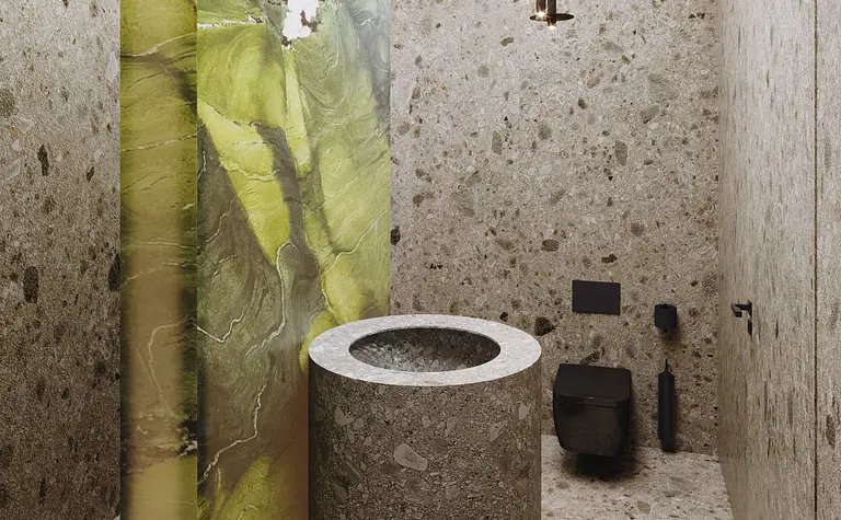 Wnętrze nowoczesnej łazienki z kamiennymi ścianami i toaletą.