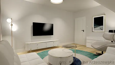 Wnętrze salonu z białą sofą, telewizorem i minimalistycznym wystrojem.