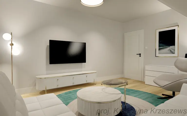 Wnętrze salonu z białą sofą, telewizorem i minimalistycznym wystrojem.