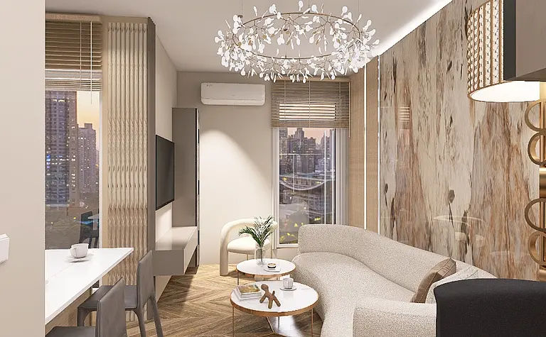 Nowoczesny salon z jasnymi meblami, dużymi oknami i dekoracyjnym żyrandolem.