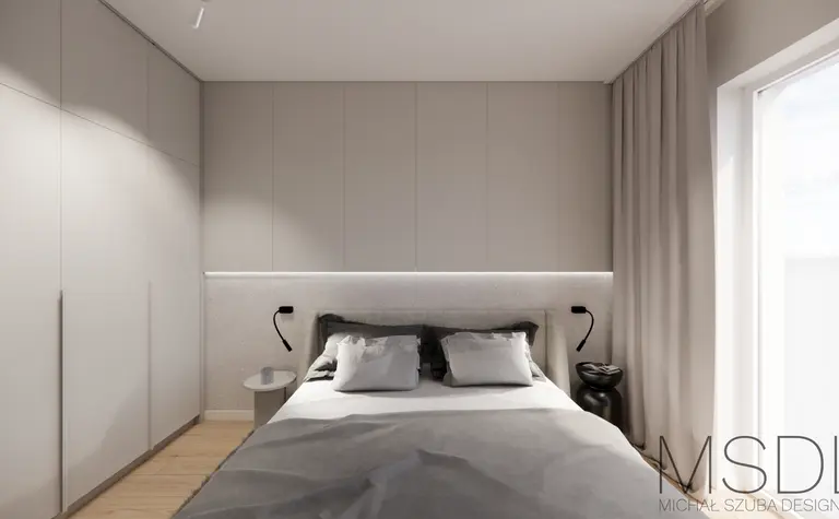 Wnętrze sypialni w stylu japandi z minimalistycznym łóżkiem i szarymi akcentami.