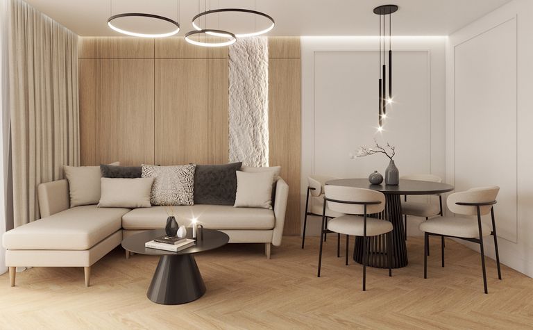 Wnętrze salonu z nowoczesnymi i tradycyjnymi akcentami, beżowa sofa i drewniane elementy.