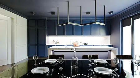 Kuchnia w stylu art deco i współczesnym z granatowymi meblami i białym blatem.