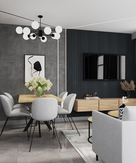 Wnętrze jadalni z minimalistycznym designem, szarymi krzesłami i drewnianym stołem.
