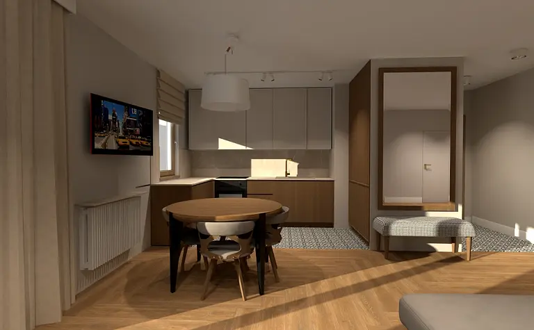 Wnętrze kuchni z drewnianym stołem, jasnymi szafkami i nowoczesnym wykończeniem.