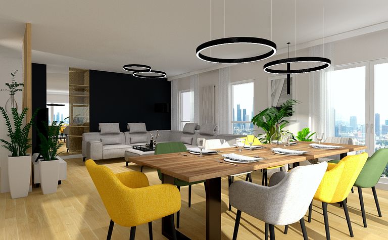 Wnętrze jadalni z drewnianym stołem, kolorowymi krzesłami i roślinami.