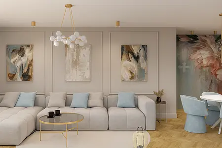 Wnętrze salonu z szarym narożnikiem i dekoracjami w stylu quiet luxury.