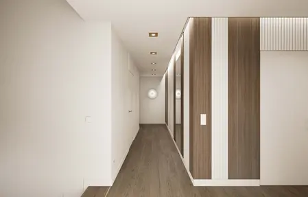 Minimalistyczny korytarz z drewnianymi meblami i białymi ścianami.
