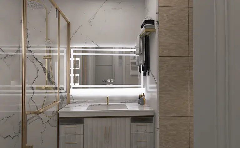 Nowoczesna łazienka z marmurowymi płytkami i złotymi dodatkami.