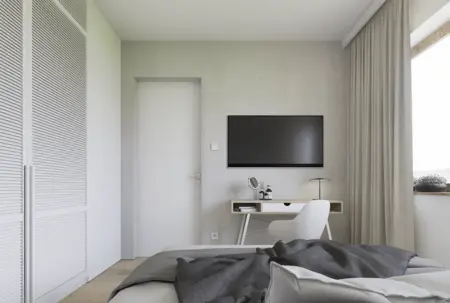 Wnętrze sypialni w stylu japandi i minimalistycznym, z szarymi ścianami i nowoczesnymi meblami.
