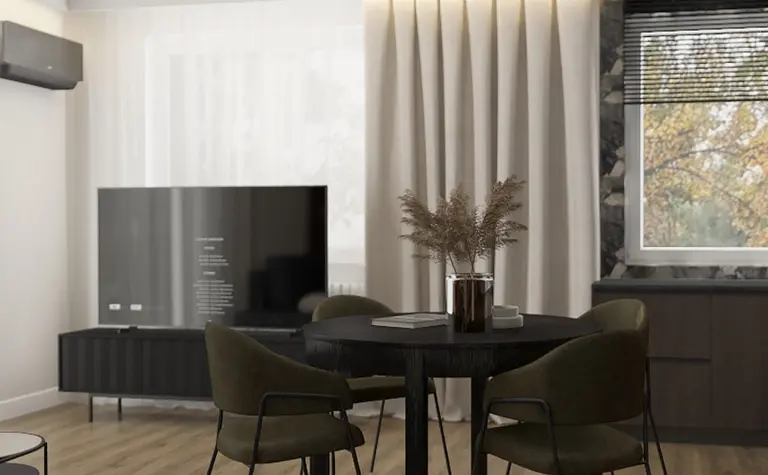 Wnętrze pokoju z drewnianym stołem, zielonymi krzesłami w stylu quiet luxury i współczesnym.