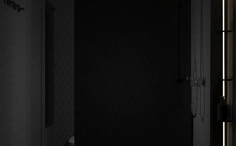 Nowoczesna łazienka z minimalistycznym prysznicem, czarnymi płytkami i oświetleniem LED.