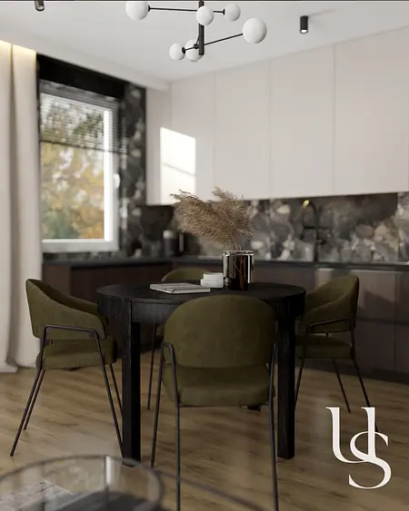 Wnętrze jadalni w stylu quiet luxury, współczesne z okrągłym stołem i zielonymi krzesłami.