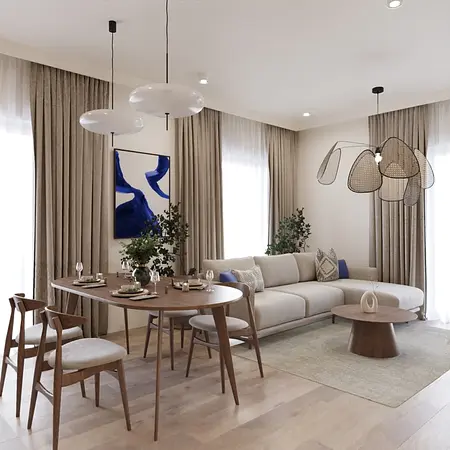 Współczesny salon z jasną sofą, drewnianym stołem i roślinami.