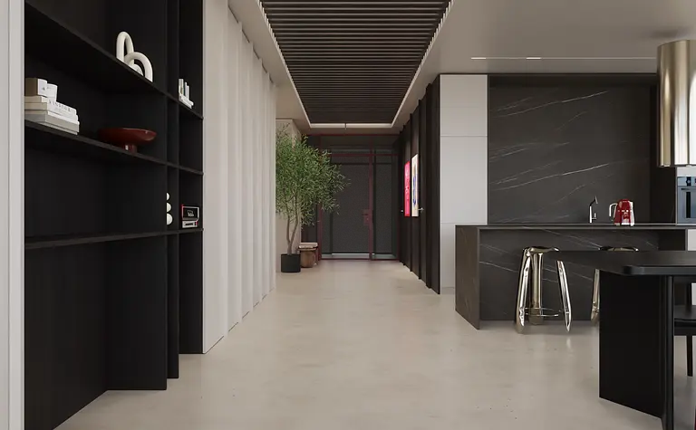 Wnętrze nowoczesnej kuchni z minimalistycznym designem, czarnymi meblami i jasnym blatem.
