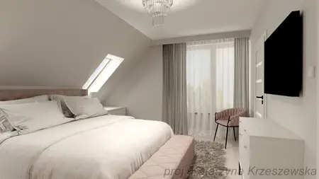Sypialnia w stylu glamour i minimalistycznym z jasnymi ścianami.