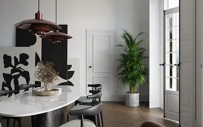 Nowoczesna jadalnia w stylu art deco z białym stołem, czarnymi dekoracjami i roślinnością.