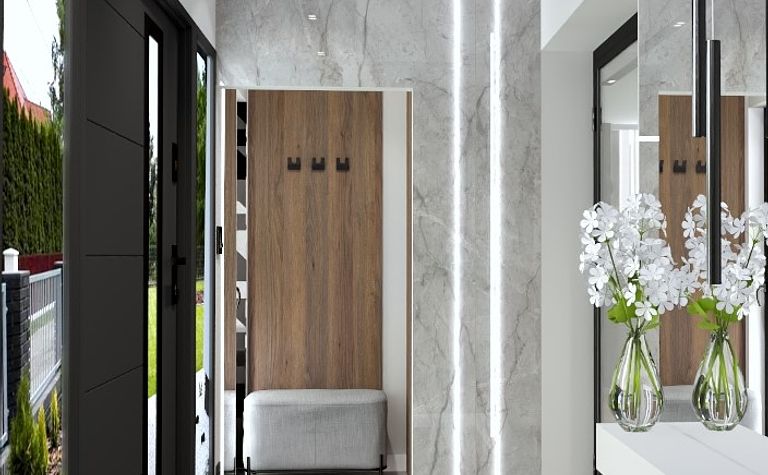 Nowoczesny przedpokój z marmurową podłogą, drewnianymi elementami i dużymi lustrami.