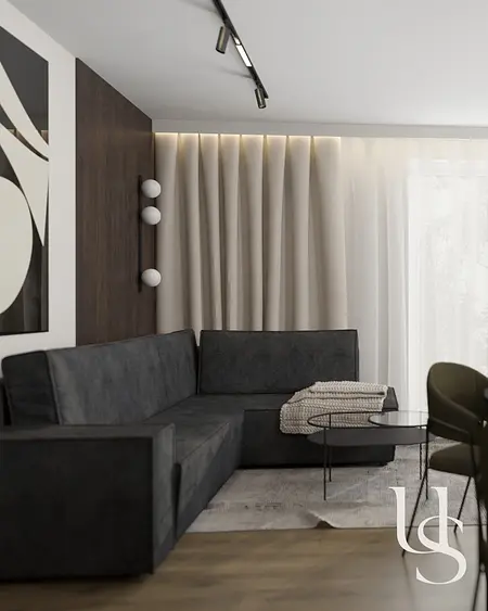 Wnętrze salonu w stylu quiet luxury, współczesne z ciemną sofą i drewnianymi detalami.