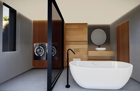 Wnętrze łazienki z wanną, pralką i drewnianymi akcentami w stylu minimalistycznym i skandynawskim.