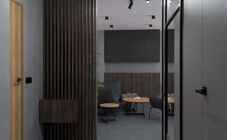 Wnętrze biura w stylu industrialnym i minimalistycznym z drewnianymi elementami.