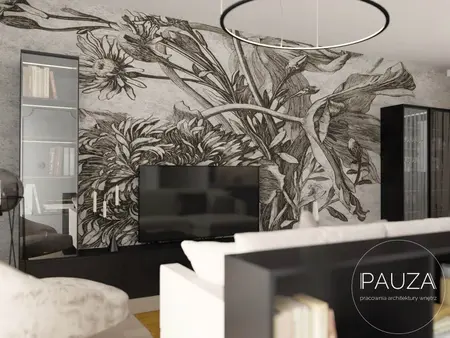 Nowoczesny salon z telewizorem i muralem roślinnym na ścianie.