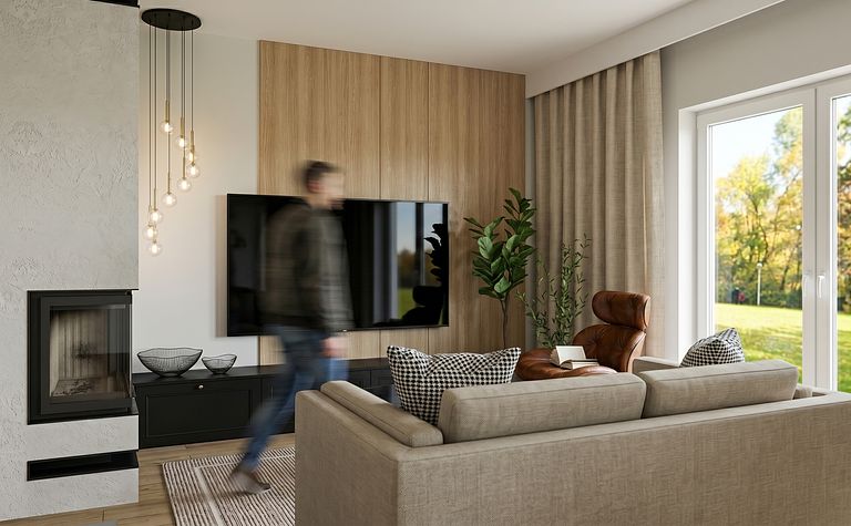 Wnętrze salonu z brązowym fotelem, telewizorem i nowoczesnym oświetleniem