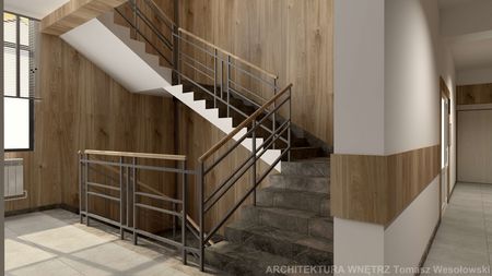 Klatka schodowa z drewnianymi panelami i metalowymi balustradami, współczesny design.