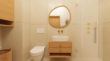 Wnętrze łazienki w stylu japandi z drewnianymi meblami i eleganckim lustrem.