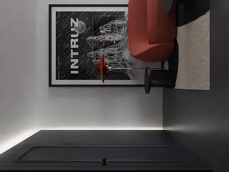 Nowoczesny salon z czerwoną sofą, czarnym stołem i grafiką na ścianie.