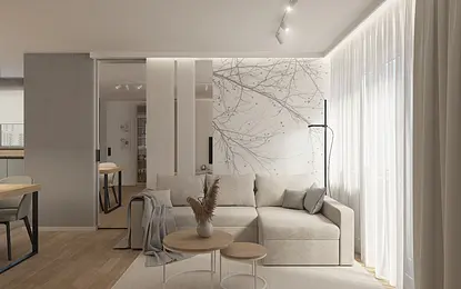 Wnętrze salonu w stylu skandynawskim z beżową sofą i drewnianymi akcentami.