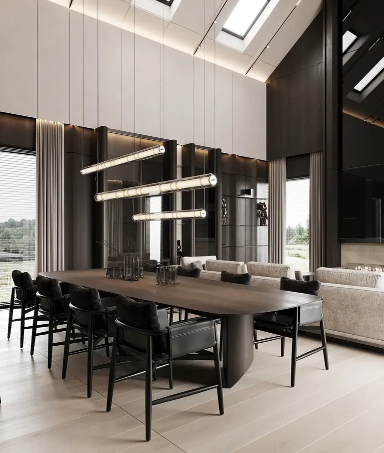 Wnętrze jadalni z dużym stołem, czarnymi krzesłami i nowoczesnym oświetleniem. Styl minimaluxe, quiet luxury.