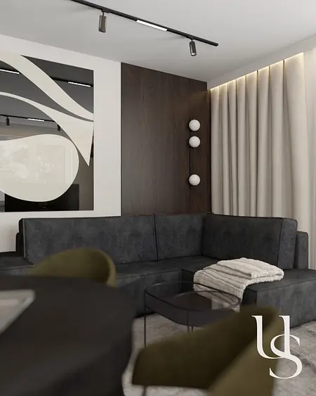 Wnętrze salonu w stylu quiet luxury, współczesnym z ciemną sofą i drewnianymi akcentami.