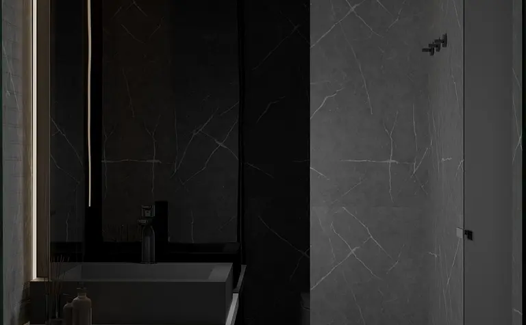 Nowoczesna łazienka w minimalistycznym stylu z czarnymi i szarymi detalami.