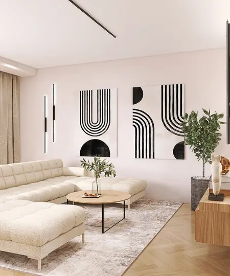 Nowoczesny salon z jasną sofą, obrazami i rośliną