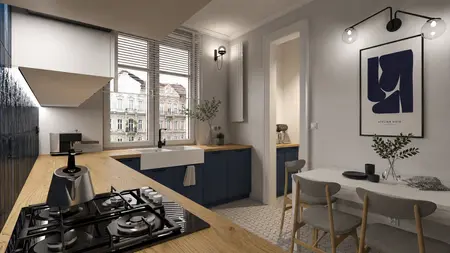 Kuchnia w stylu art deco i minimalistycznym z niebieskimi meblami i drewnianym blatem.