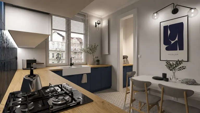 Kuchnia w stylu art deco i minimalistycznym z niebieskimi meblami i drewnianym blatem.