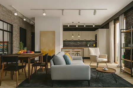 Wnętrze salonu z industrialnym i minimalistycznym stylem, szary dywan, drewniany stół.