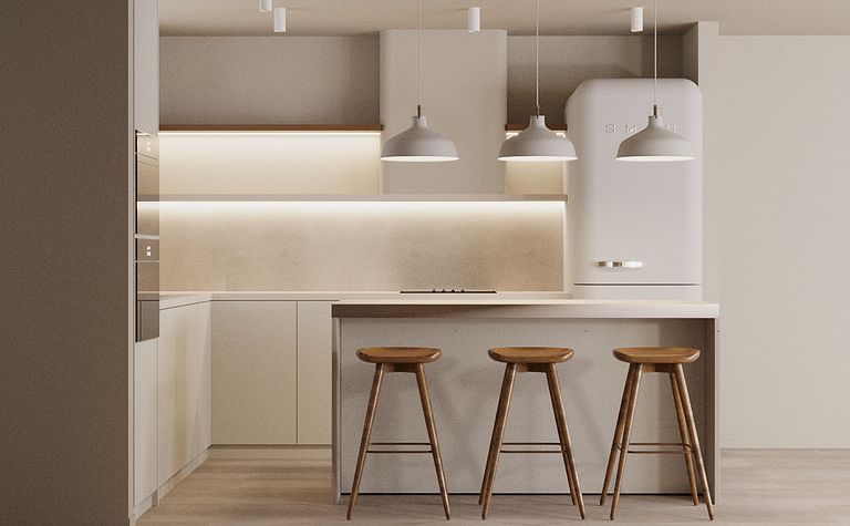Kuchnia w stylu japandi i minimalistycznym z białymi meblami i drewnianymi elementami.