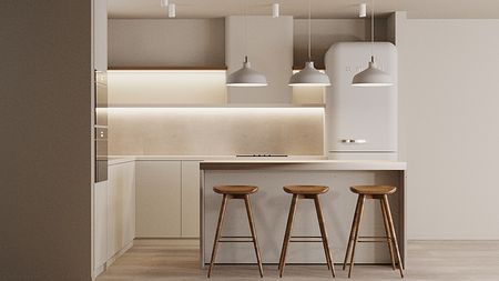 Kuchnia w stylu japandi i minimalistycznym z białymi meblami i drewnianymi elementami.