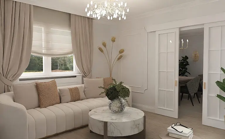 Wnętrze salonu w stylu art deco z beżową sofą i białym stolikiem.
