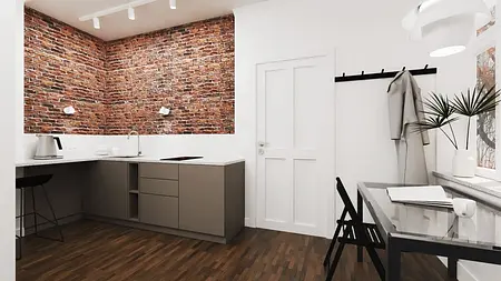 Kuchnia w stylu industrialnym i vintage z ceglaną ścianą i nowoczesnymi meblami.