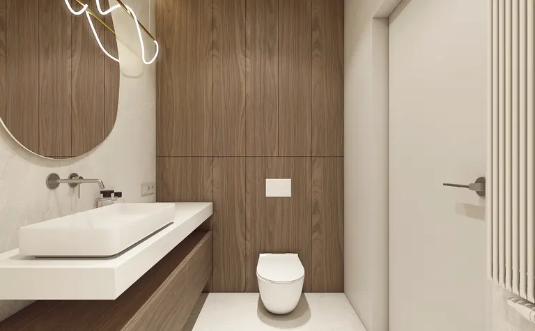 Wnętrze łazienki z drewnianymi panelami i minimalistycznym designem w stylu japandi.