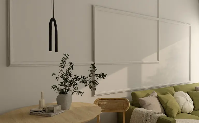 Wnętrze z nowoczesnym i skandynawskim stylem, zielona sofa, drewniany stół, rośliny.