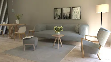 Wnętrze salonu w stylu boho i skandynawskim z szarym narożnikiem.