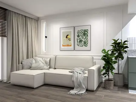 Wnętrze salonu z białą sofą, zielonymi roślinami i minimalistycznymi detalami.
