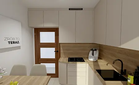 Wnętrze kuchni z białymi meblami i drewnianym blatem, współczesny styl.